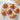 A set of freshly baked croissants and pain au chocolats on a cooling rack.