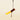 A piece of mango enrobed in 65% dark chocolate is being drizzled with rich bean-to-bar chocolate against a light beige background.